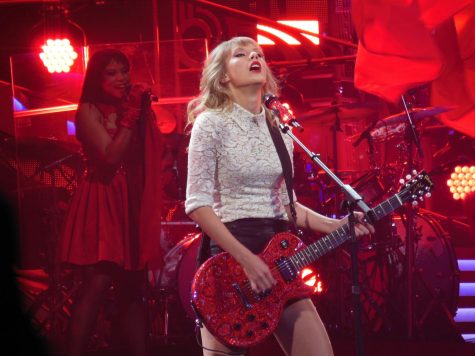 Swift performing on stage during the Red tour, March of 2013.