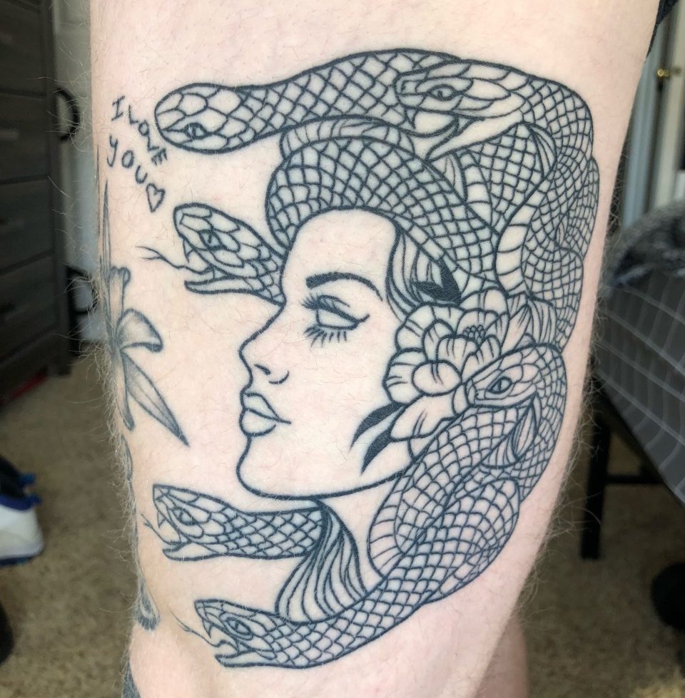 Arm tattoo of Medusa as a statue with snakes for hair tattoo idea |  TattoosAI