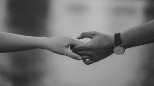 a couple holding hands 