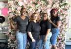 Photo of Bur-men Law Group Team standing in front of a rose wall at Cousel